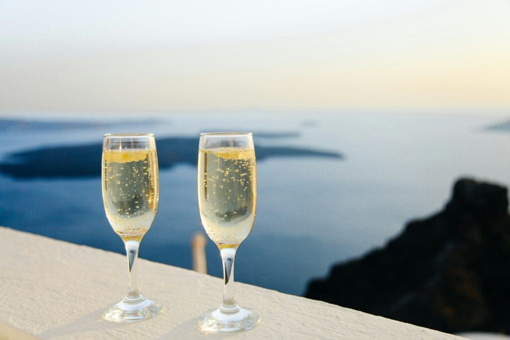A newlywed couple relaxing on a beach in a tropical honeymoon destination"